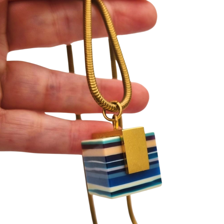 Vintage pop art resin striped blue multicolored pendant with gold metal circa 1980s