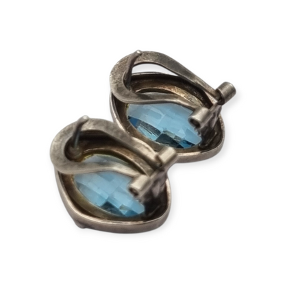 Oval silver earrings with faceted blue stone, circa 1980-90