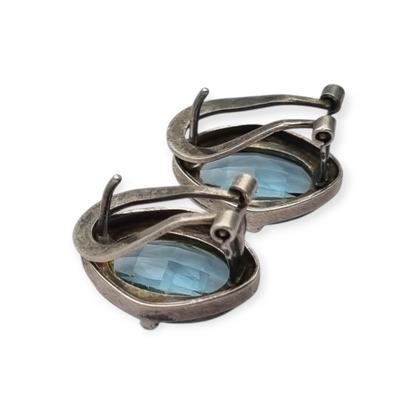 Oval silver earrings with faceted blue stone, circa 1980-90