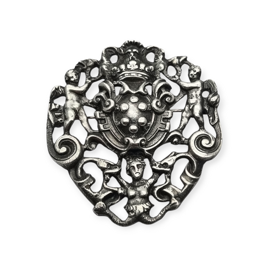 Neo-Renaissance silver brooch, heraldic shield with cherubs Italy 20th century