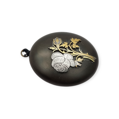 Victorian vulcanite locket, mourning jewelry, raised flower, England circa 1890-1900