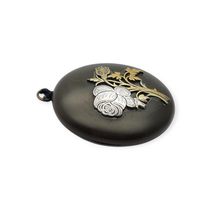Victorian vulcanite locket, mourning jewelry, raised flower, England circa 1890-1900