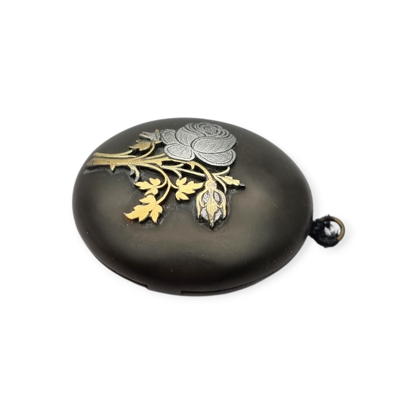 Victorian vulcanite locket, mourning jewelry, raised flower, England circa 1890-1900