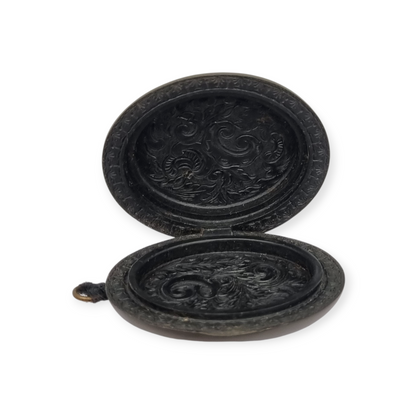 Victorian vulcanite locket, mourning jewelry, raised flower, England circa 1890-1900