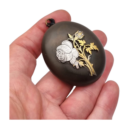 Victorian vulcanite locket, mourning jewelry, raised flower, England circa 1890-1900