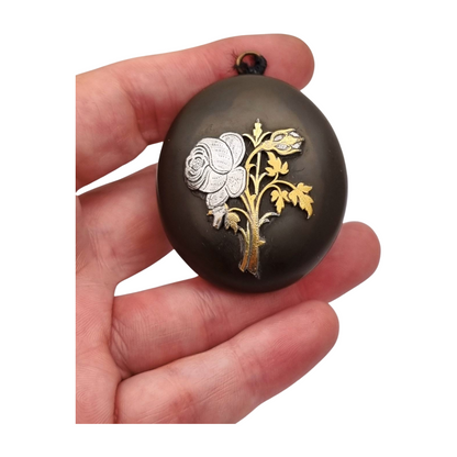 Victorian vulcanite locket, mourning jewelry, raised flower, England circa 1890-1900