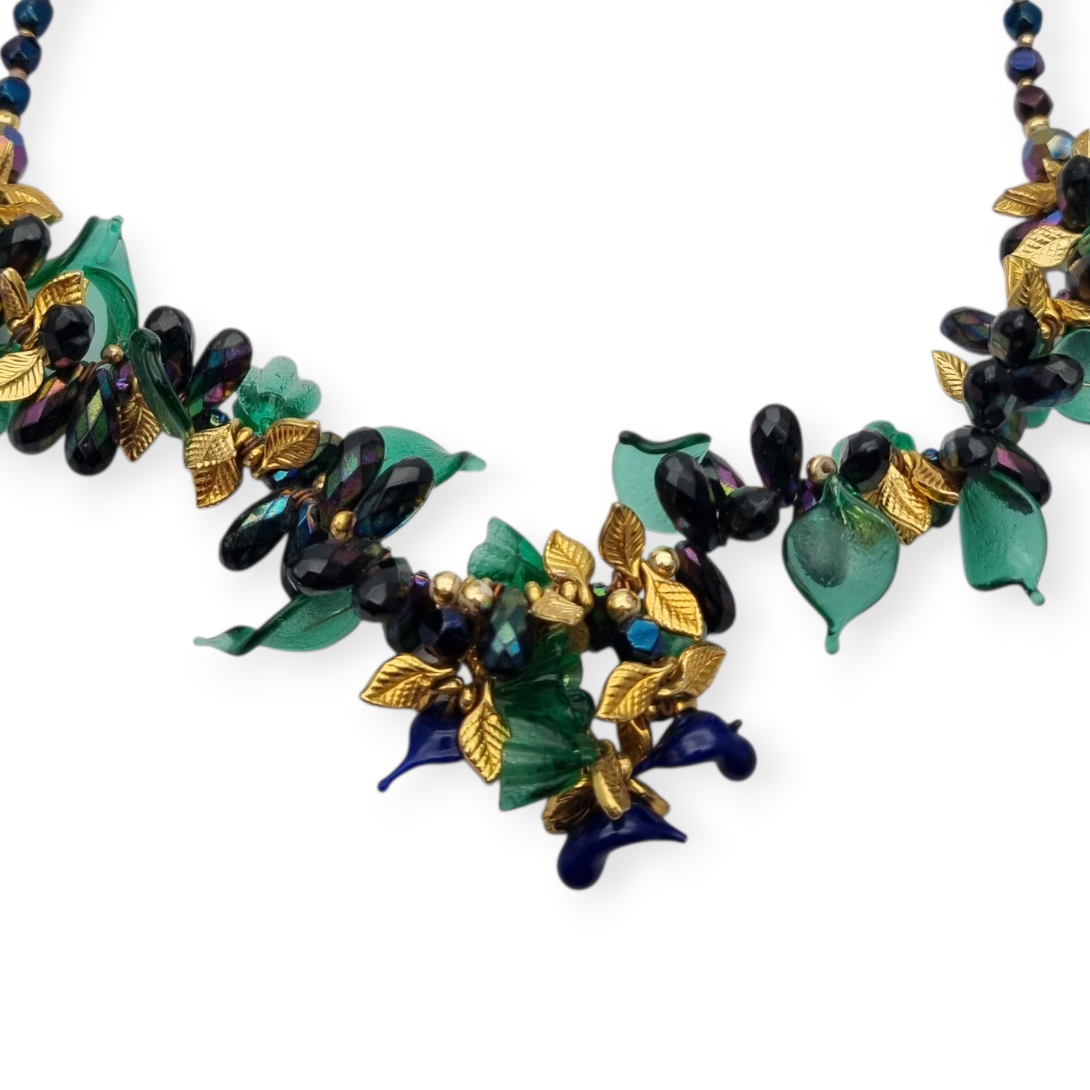 Vintage floral necklace with iridescent beads, leaves, flowers, and blue birds, circa 1990-2000