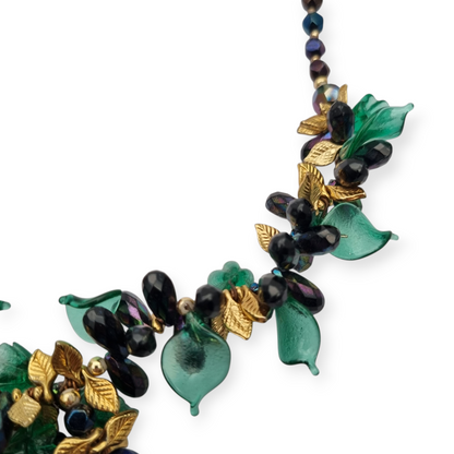Vintage floral necklace with iridescent beads, leaves, flowers, and blue birds, circa 1990-2000