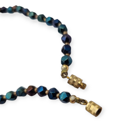 Vintage floral necklace with iridescent beads, leaves, flowers, and blue birds, circa 1990-2000