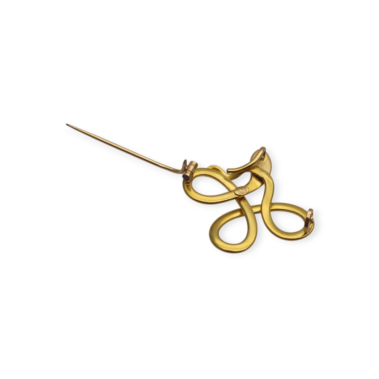 Broche francés FIX con serpiente entrelazada., oro laminado y piedra roja circa 1910