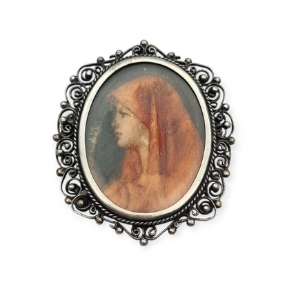 Broche colgante de plata 800 y filigrana con miniatura de Santa Fabiola, circa 1920