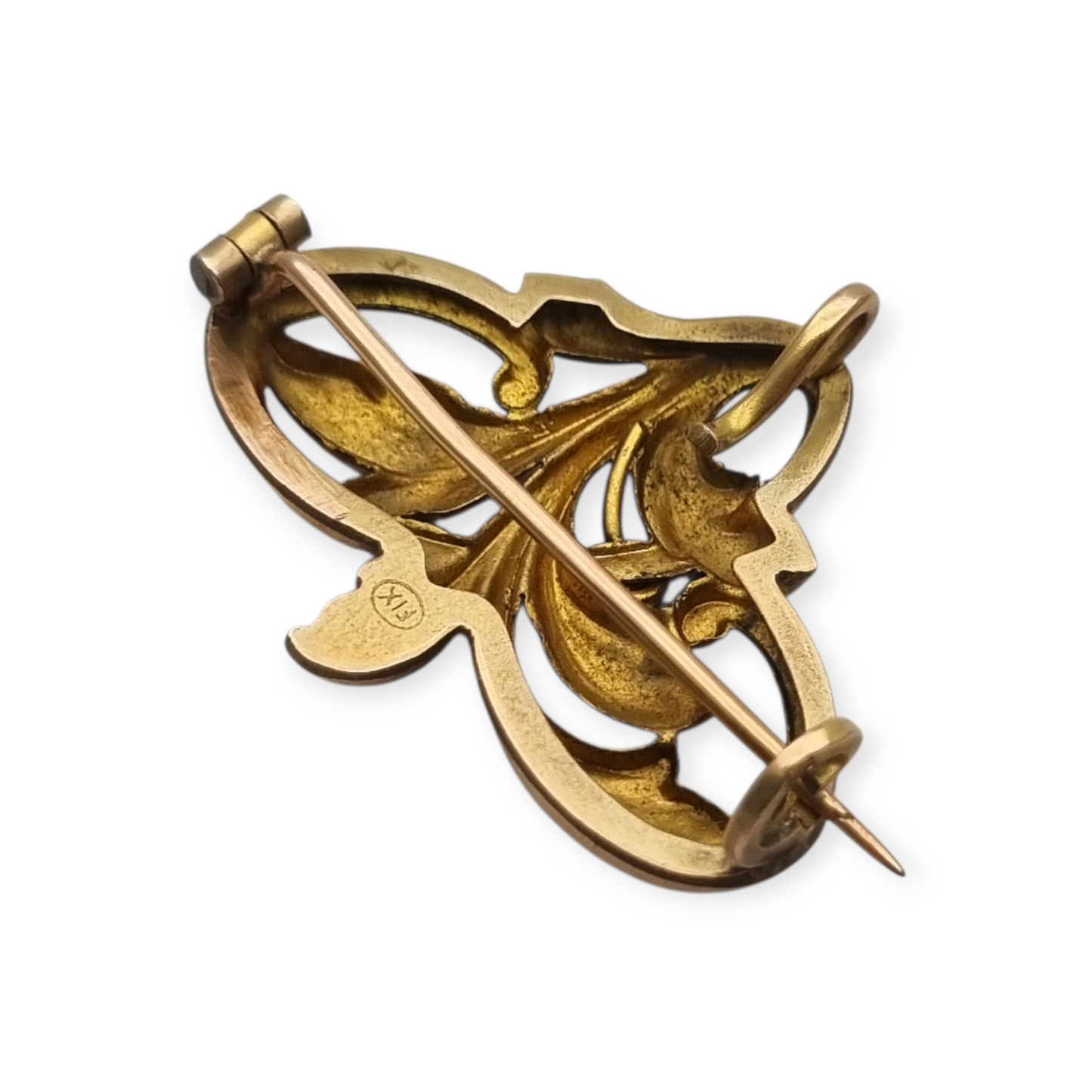 Broche FIX Art Nouveau laminado en oro con piedra verde y diseño floral, circa 1920