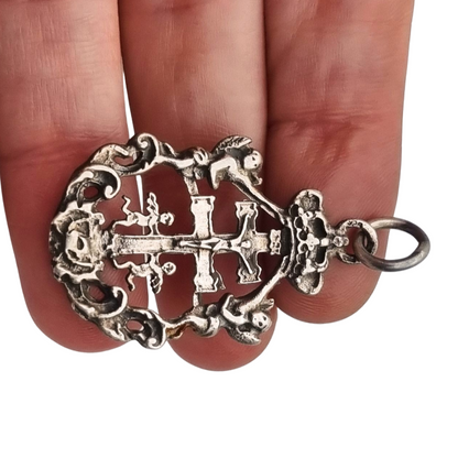 Sterling silver religious pendant with Caravaca cross and cherubs circa 1970-80
