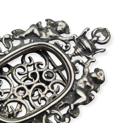 Pierced sterling silver photo frame for a portrait with cherubs, circa 1940-1950