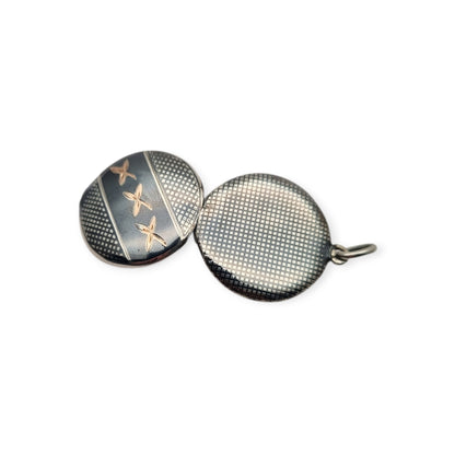 Round locket in nielloed 800 silver with hand engravings, circa 1920-1930