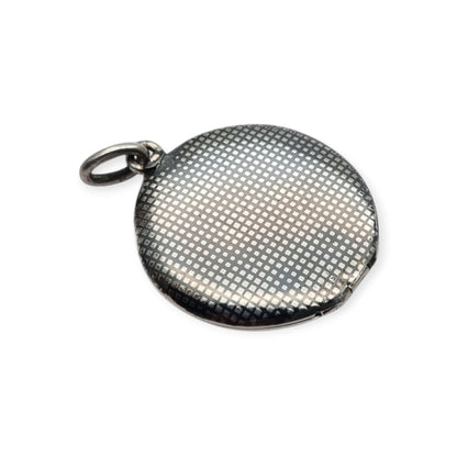 Round locket in nielloed 800 silver with hand engravings, circa 1920-1930