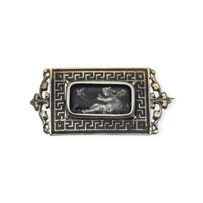 Antique rectangular metal and black enamel brooch with a classical scene, late 19th century