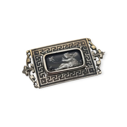 Antique rectangular metal and black enamel brooch with a classical scene, late 19th century