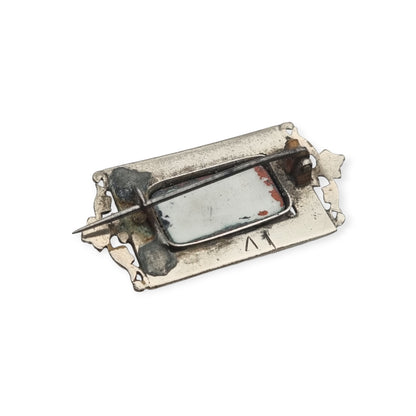 Antique rectangular metal and black enamel brooch with a classical scene, late 19th century