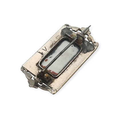Antique rectangular metal and black enamel brooch with a classical scene, late 19th century