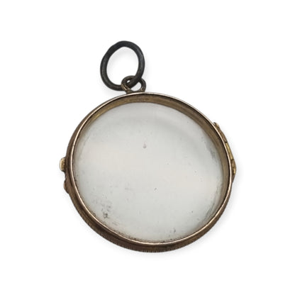 Antique round metal and beveled glass locket pendant, circa 1920