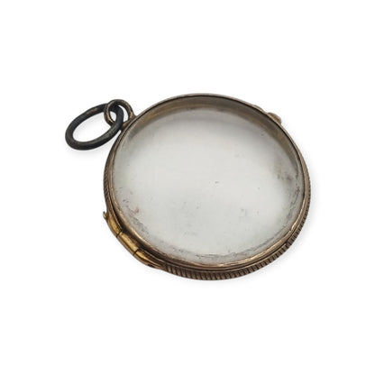 Antique round metal and beveled glass locket pendant, circa 1920
