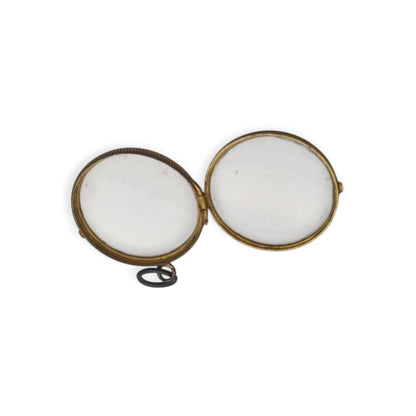 Antique round metal and beveled glass locket pendant, circa 1920