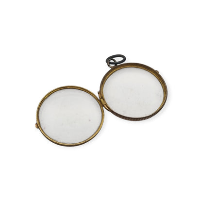 Antique round metal and beveled glass locket pendant, circa 1920
