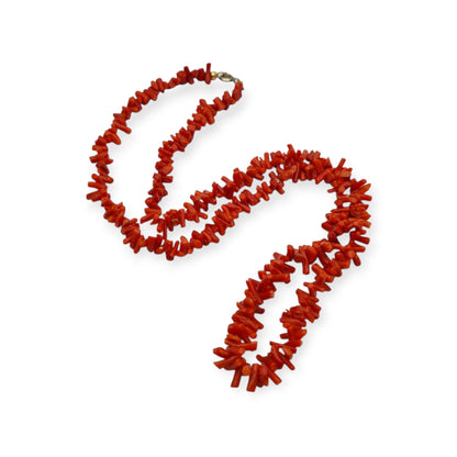 Boho necklace of natural red coral with irregular branches and metal clasp, circa 1970-80