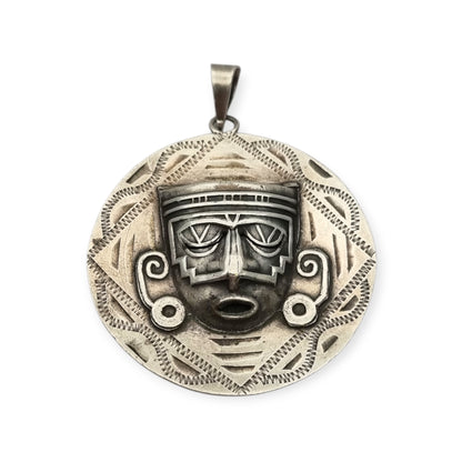 Reversible .925 sterling silver Aztec calendar and mask pendant, Mexico, 1960s-70s