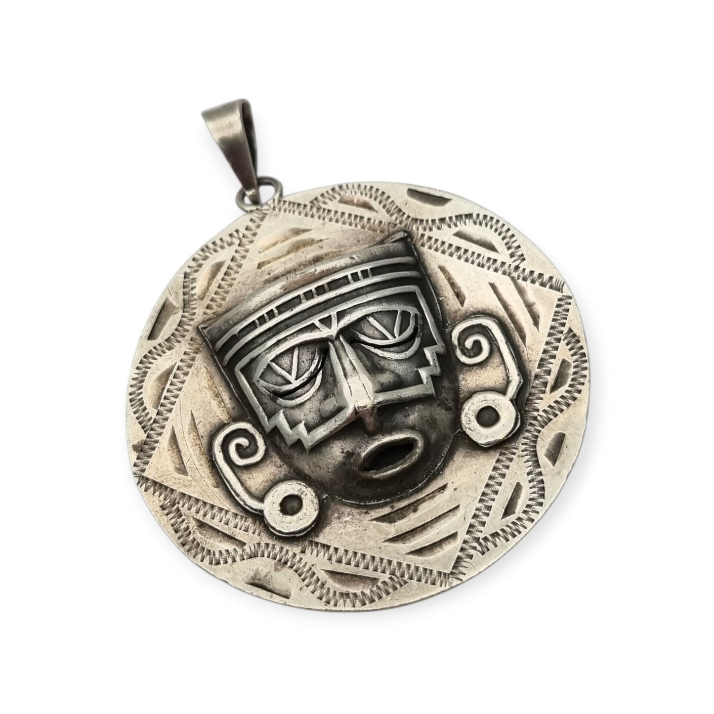 Reversible .925 sterling silver Aztec calendar and mask pendant, Mexico, 1960s-70s