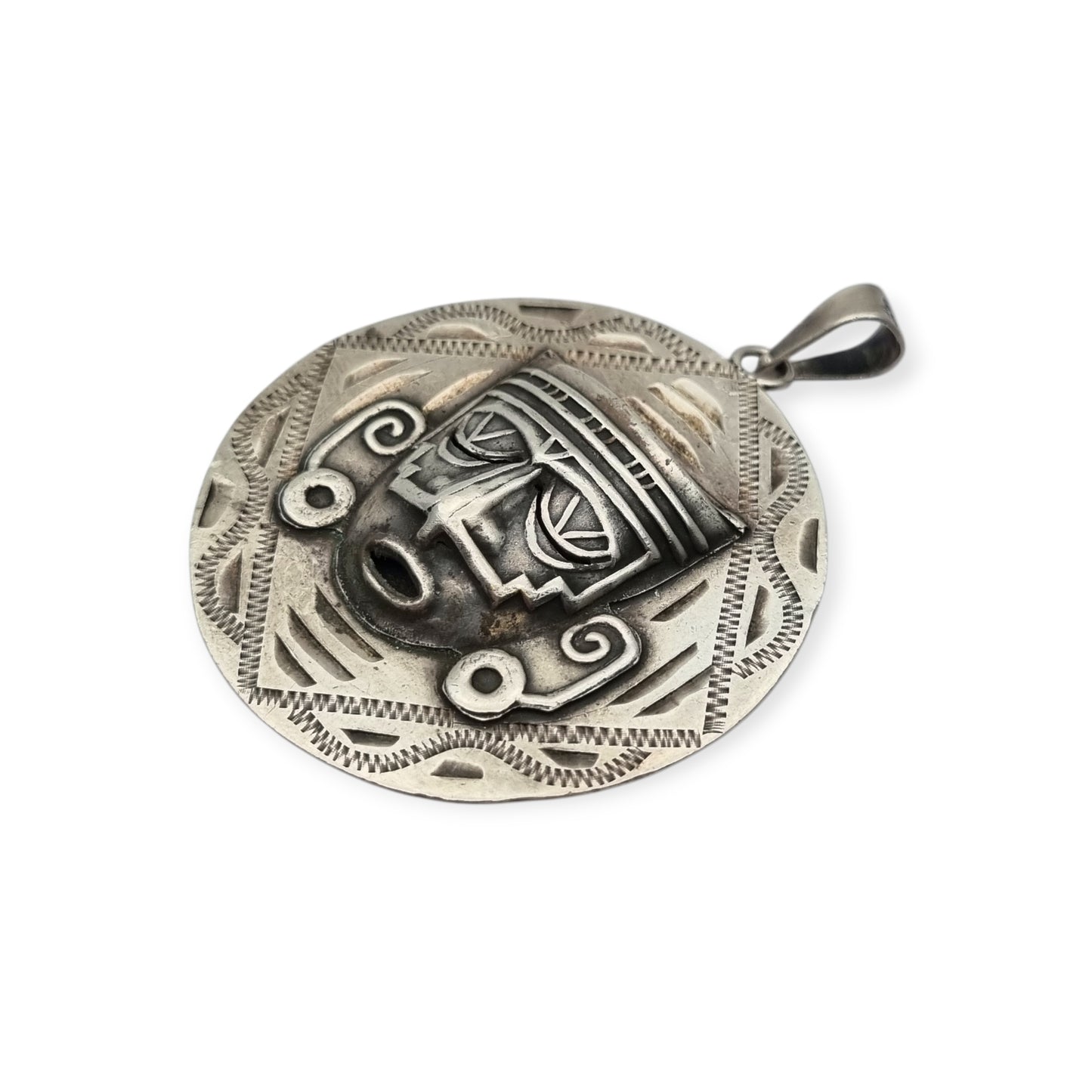 Reversible .925 sterling silver Aztec calendar and mask pendant, Mexico, 1960s-70s