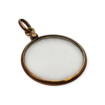 Circular gilded metal and glass locket, antique photo holder, c. 1900
