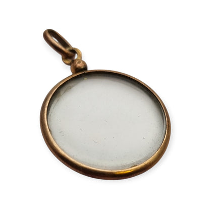 Circular gilded metal and glass locket, antique photo holder, c. 1900