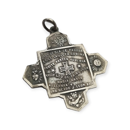 Catholic devotional silver-tone metal Saint Anthony of Padua cross medal, circa 1970