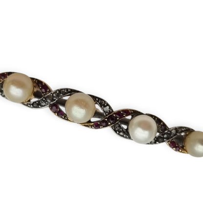 Broche Belle Époque de oro de 14 k y metal blanco con perlas, rubíes y zafiros blancos circa 1900