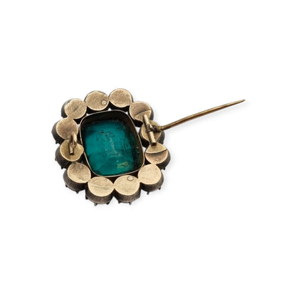 Antique Victorian silver, gold, and green and white paste brooch, inspired by the aesthetics of Queen Victoria's jewelry. Europe, circa 1890