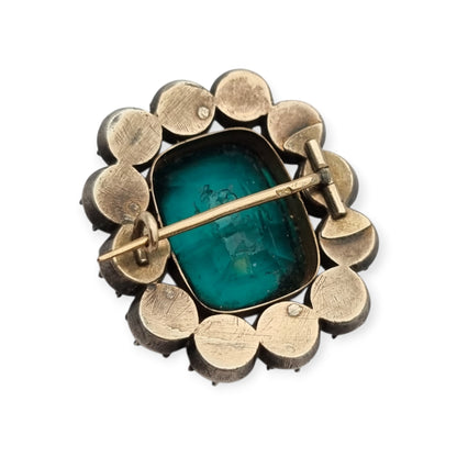 Antique Victorian silver, gold, and green and white paste brooch, inspired by the aesthetics of Queen Victoria's jewelry. Europe, circa 1890