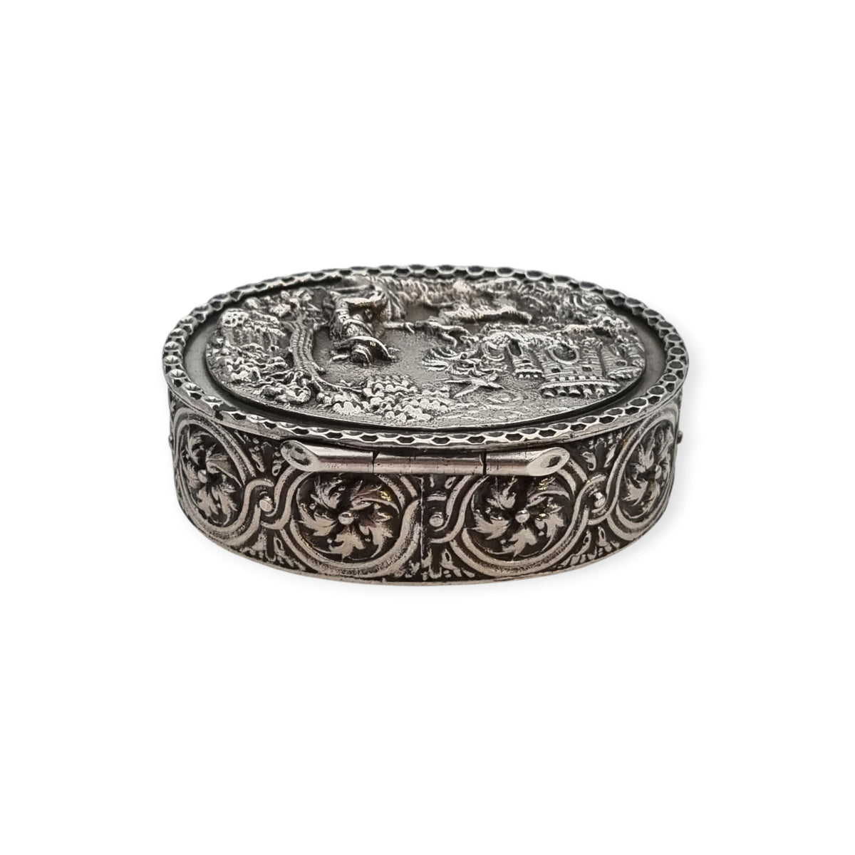 Rococo Revival oval silver box with gilt interior and pastoral scene in relief, circa 1940–1950