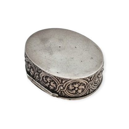 Rococo Revival oval silver box with gilt interior and pastoral scene in relief, circa 1940–1950