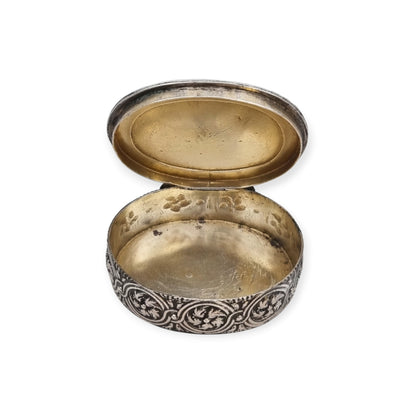 Rococo Revival oval silver box with gilt interior and pastoral scene in relief, circa 1940–1950