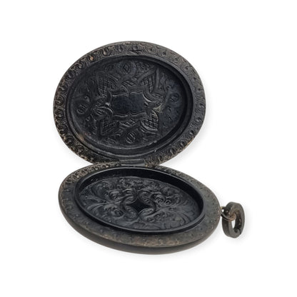 Victorian black vulcanite mourning locket with high-relief flowers, England, c. 1880–1900