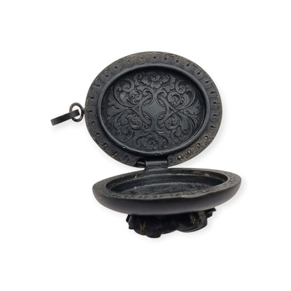 Victorian black vulcanite mourning locket with high-relief flowers, England, c. 1880–1900