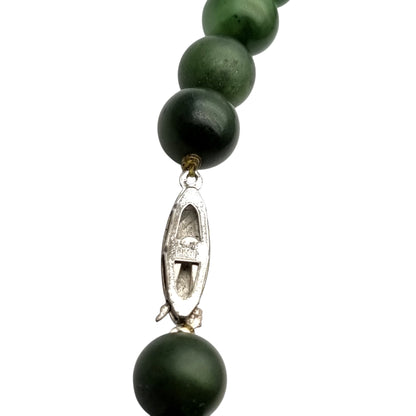 Long vintage nephrite green jade necklace with spherical beads Circa 1950