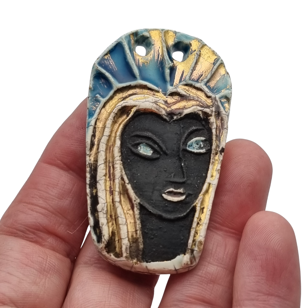Handmade ceramic pendant with a Modernist Marian bust, enameled piece with golden highlights, European, 1960–1980s