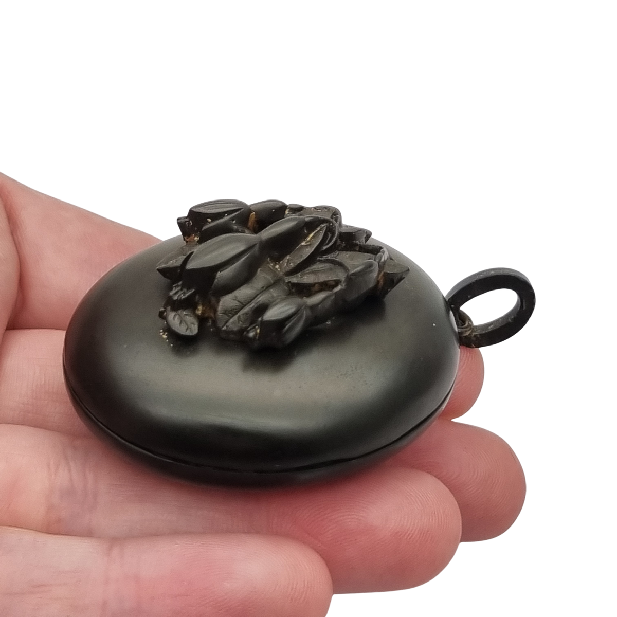 Victorian black vulcanite mourning locket with high-relief flowers, England, c. 1880–1900