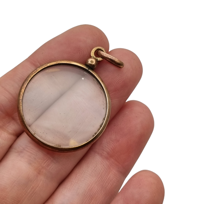 Circular gilded metal and glass locket, antique photo holder, c. 1900
