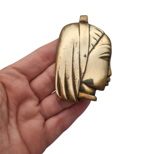 Large bronze sculptural pendant with a stylized female head, circa 1980-1990