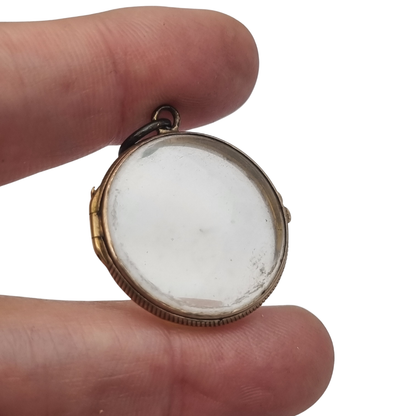 Antique round metal and beveled glass locket pendant, circa 1920