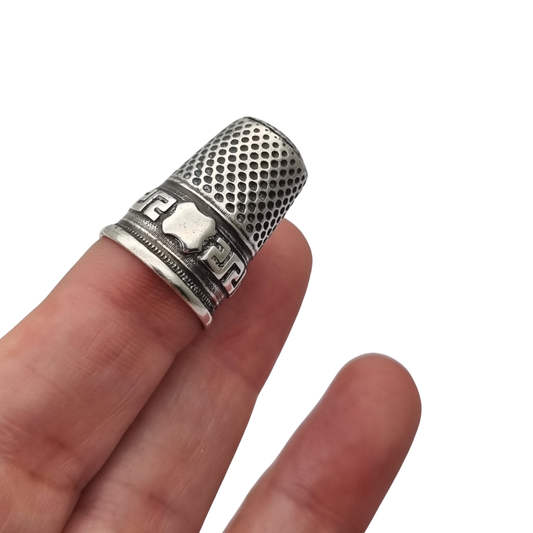 European silver thimble with geometric fretwork decoration and plain cartouche circa 1960